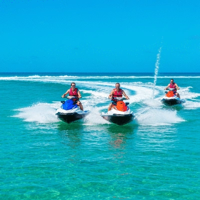 People riding jet skis on a sunny day in Australia, showcasing fun and adventure